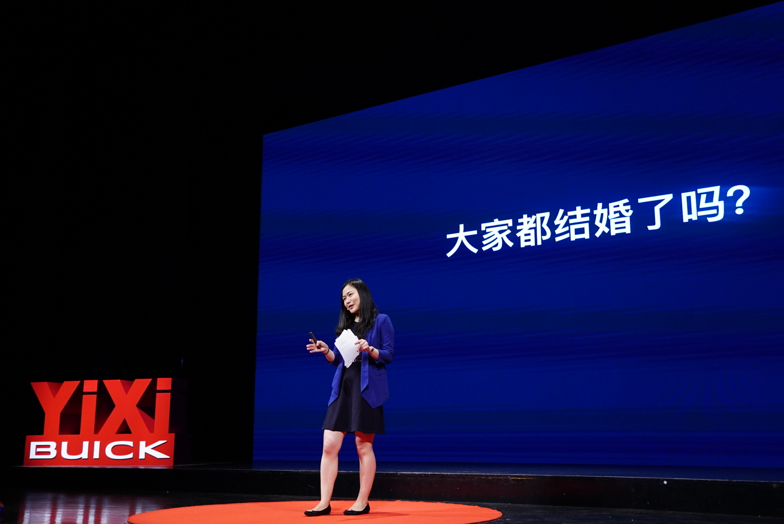 Yue Qian speaking on the Yixi stage